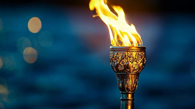 A golden torch burns brightly against a blue, out-of-focus background