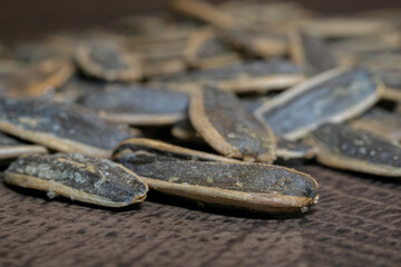 Black sunflower seeds. Salty cruchy sunflower seeds close up.