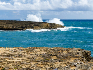 waves crashing into a clifff in Hawaii