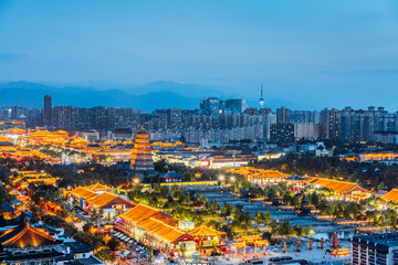 Fototapeta premium High Anlge View of urban skyline night view of the Big Wild Goose Pagoda in Xi'an, Shaanxi, China