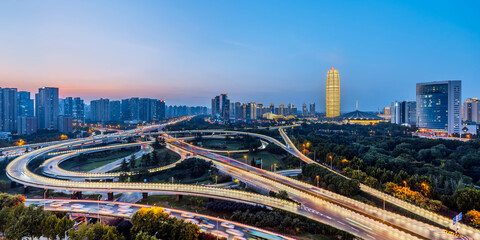 Naklejka premium Night view of CBD and overpass in Zhengdong New District, Zhengzhou, Henan Province, China