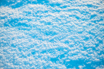 Natural snow background, snow glitters and shimmers in the sun, natural snow texture