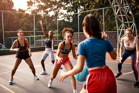 Women, team and ball on basketball player on court as athlete for challenge, cardio and training. Female people, warm up and outdoor for competition, match and sports in physical activity or exercise