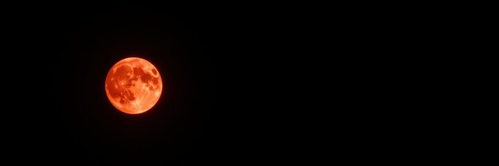 A stunning close-up image of a deep red moon against a dark sky, showing its craters and unique hue, beauty, space