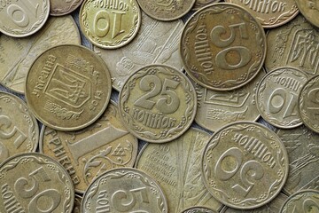 Big pile of different coins from various time period in Ukraine. Shiny Ukrainian money background