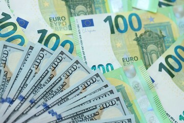 Big pile of Euro and USD banknotes. Many european and united states dollars