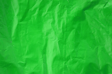 Texture of Green color plastic bag smooth crumpled surface