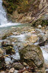 gorge with a river in the mountains, blue water, blue river, waterfalls, rocks and mountains