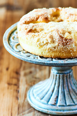 Simple yeast cake on rustic wooden background. Close up. Copy space.
