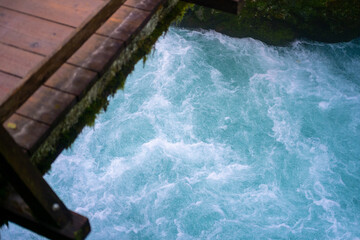 gorge with a river in the mountains, blue water, blue river, waterfalls, rocks and mountains