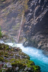 gorge with a river in the mountains, blue water, blue river, waterfalls, rocks and mountains