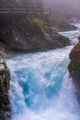 gorge with a river in the mountains, blue water, blue river, waterfalls, rocks and mountains