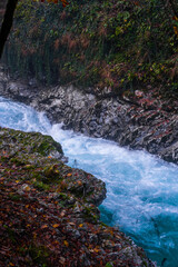 gorge with a river in the mountains, blue water, blue river, waterfalls, rocks and mountains
