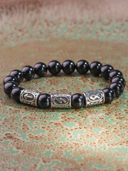 Black Obsidian stone bracelet , Chinese men's modern retro style fashion. Isolated on white...