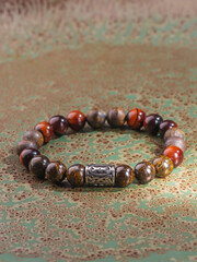 Black Obsidian stone bracelet , Chinese men's modern retro style fashion. Isolated on white...