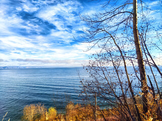 Tranquil shores of Baikal Lake in Russia, capturing the beauty of nature during a serene autumn day