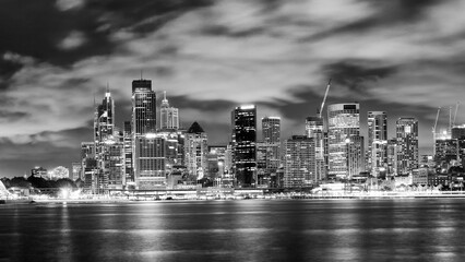 Sydney Skyline Illuminated at Night with Reflective Harbor Waters
