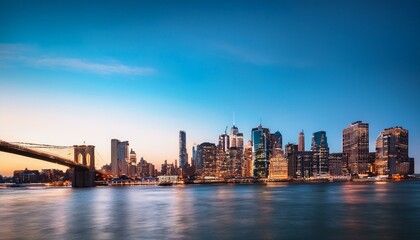 Obraz premium Manhattan skyline at dusk over the river, New York City.
