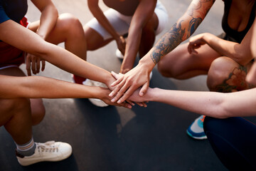 Team, fitness and hands in for training, exercise and game motivation with solidarity. People, workout and sport court above with teamwork, athlete and group with community at match on ground