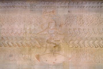 Scene of the Churning of the Milk Ocean carvings status on the wall of Angkor wat temple, world heritage, Siem Reap, Cambodia