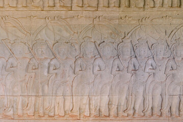 Scene of the Churning of the Milk Ocean carvings status on the wall of Angkor wat temple, world heritage, Siem Reap, Cambodia