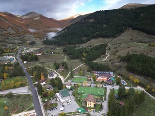 Aerial view of Pescasseroli in the Abruzzo Lazio and Molise National Park. The foliage in autumn