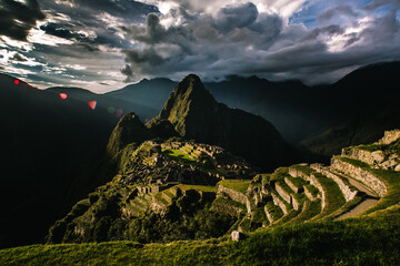 Machu Pichu at sunset with dramatic clouds