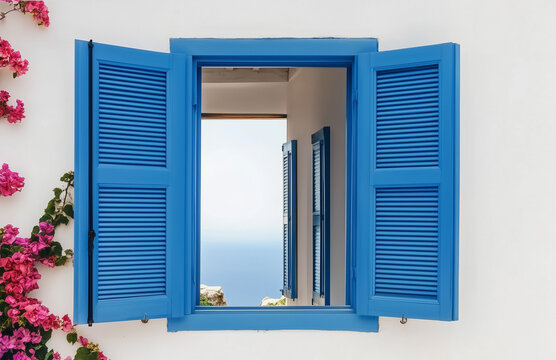 Fototapeta beautiful house in Andalusia, Spain next to the sea with an open window in which you can see the blue sea through another window on the other side of the house