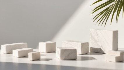 Marble blocks with palm leaf shadow in sunlight.