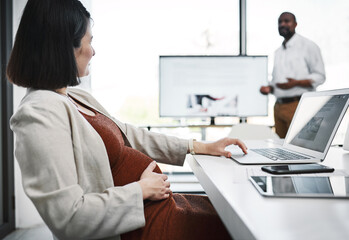 Fototapeta premium Business, meeting and pregnant woman on laptop in office for training, research or editor listen to presentation. Pregnancy, computer and employee working with team for discussion in creative startup