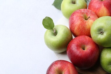 Fresh ripe apples on light grey table, closeup. Space for text