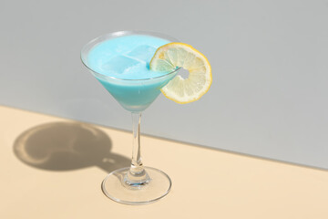 Classic Blue Margarita Served in Martini Glass. Highlights the elegance of a timeless cocktail for bar or beverage marketing.