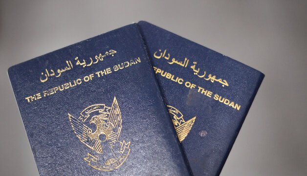 The Republic of Sudan passport with a gilded falcon in the center of the front cover, selective focus of Sudanese passport identity of North Sudan used for having visa stamps during traveling