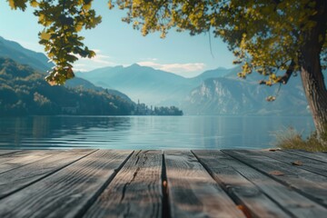 Wooden deck with a scenic view of a lake and surrounding mountains, perfect for outdoor activities or relaxation
