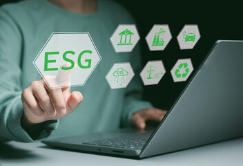 People use laptop with ESG icon of saving clean energy environmental, social, governance, sustainable and corporation development, green eco friendly, environment, go green, CO2, ESG concept.