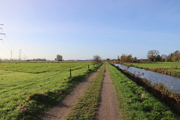 Oene, Netherlands. 02-11-2024. A very dutch flat rural landscape. A hiking trail along the stroombreed canal. 