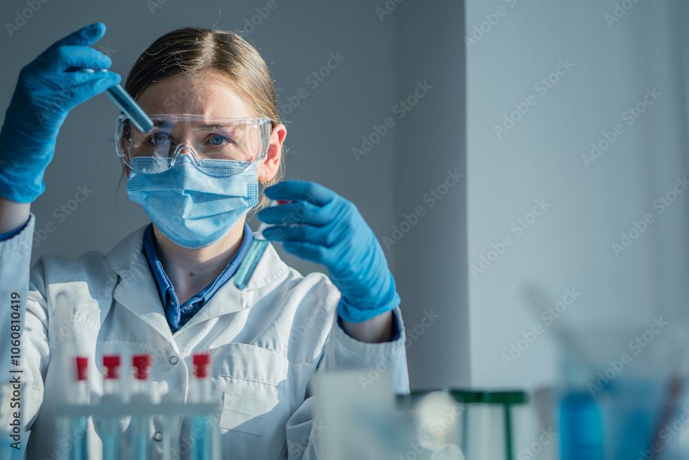 Poster A dedicated scientist is conducting a detailed experiment within a wellequipped laboratory, utilizing various test tubes and a precision pipette for their meticulous research work