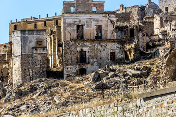 Abandoned ruins of the ghost town of Craco. A city abandoned due to an earthquake in the late 20th century. Province of Matera, Basilicata, Italy