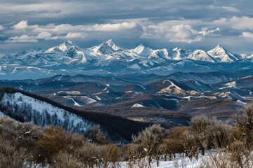 A view of a mountain range with snow covering the ground, great for winter scenes or outdoor activities