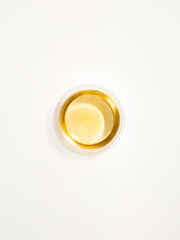 Top view of green tea in a glass transparent cup isolated on white background. Milk oolong tea. 