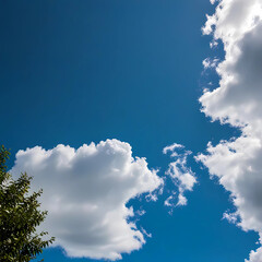 clear blue sky with a few clouds. The sky is very bright and the clouds are scattered