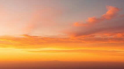 Fototapeta premium Vibrant sunset over the horizon with colorful clouds reflecting the light, yellow, colorful