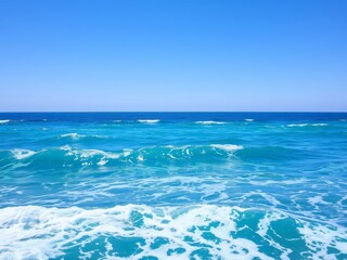 Obraz premium Vibrant blue ocean background with clear skies and sparkling water, waves, peaceful