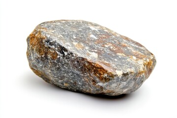 Fototapeta premium A single large rock sits on a smooth white surface, perfect for use in interior design or product photography