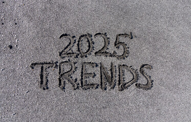 Planning trends 2025 new year symbol. Concept words Trends 2025 written on beautiful sand beach. Beautiful sand beach background. Business trends 2025 new year concept. Copy space.