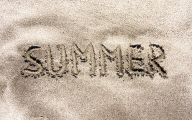 Summer vacation concept. Concept word Summer written on beautiful ocean sand beach. Beautiful ocean sand beach background, copy space. Business Summer vacation concept.