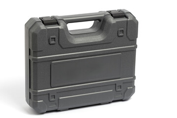Grey plastic tool suitcase on white background.