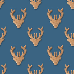 Fototapeta premium Seamless pattern of Christmas wooden reindeer on neutral beige background in Scandinavian style. Xmas scandi abstract wallpaper for fabric prints or wrapping paper.
