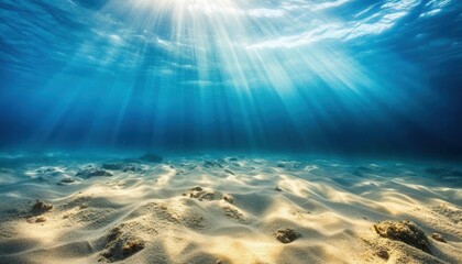 Underwater scene showcasing sandy seabed illuminated by sun rays, creating a serene aquatic atmosphere.