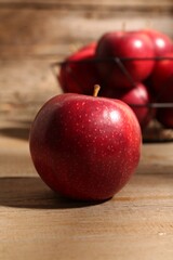 Fresh ripe red apples on wooden table